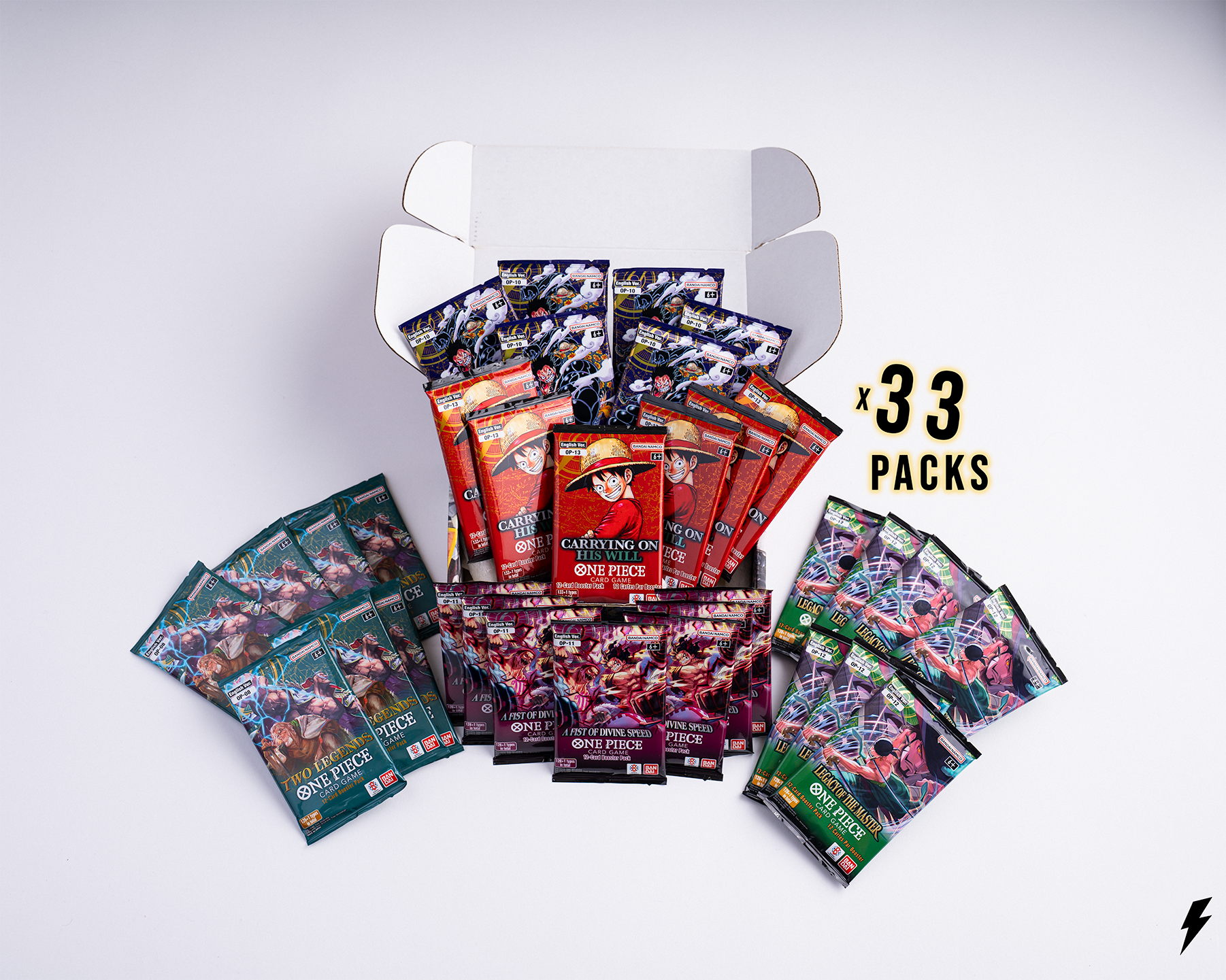 Open Booster Crate box containing 33 One Piece booster packs from assorted sets, arranged around the box with “x 33 Packs” text on the right.
